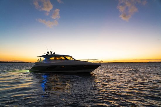anchored-riviera-sport-yacht-6000-at-dusk