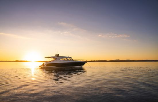 anchored-riviera-sport-yacht-5400-at-sunset