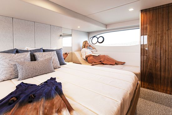 woman-in-the-riviera-sport-yacht-4600-master-stateroom