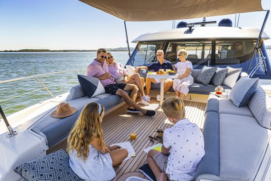 family-spending-time-on-the-foredeck-of-the-riviera-SUV-645