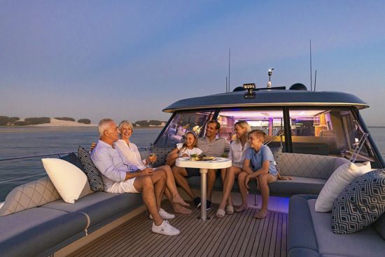 family-hanging-out-on-the-foredeck-of-the-riviera-SUV-645