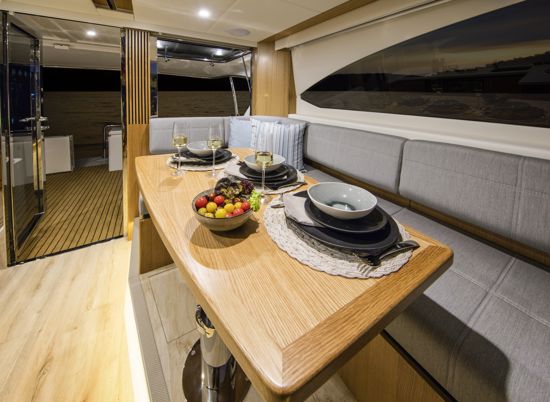 SUV-395-saloon-dining-area-with-oak-timber-finish