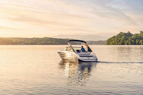 Sea Ray 230 SDX OB resting in calm turquoise waters
